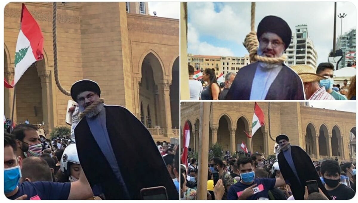 Demonstranten in Beirut hängen eine Pappfigur von Hisbollah-Chef Hassan Nasrallah. (Quelle: Twitter)