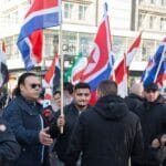 Assad-anhänger in Deutschland demonstrieren mit Iran- und Nordkorea-Flaggen